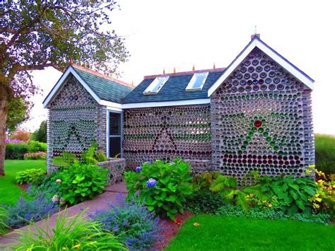 house made in a scrap metal workshop|recycled material homes.